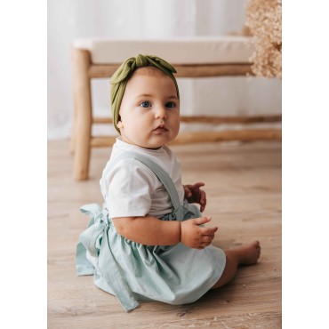 Skirt-romper. Adjustable straps with buttonholes
